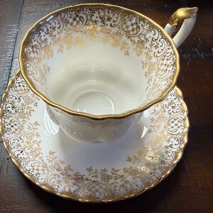 Vintage Royal Albert bone china teacup and saucer, white and gold chintz pattern